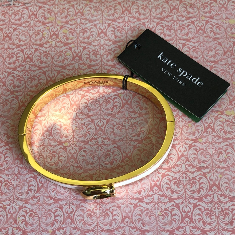Authentic New with tag. Coach magnetic open bangle.